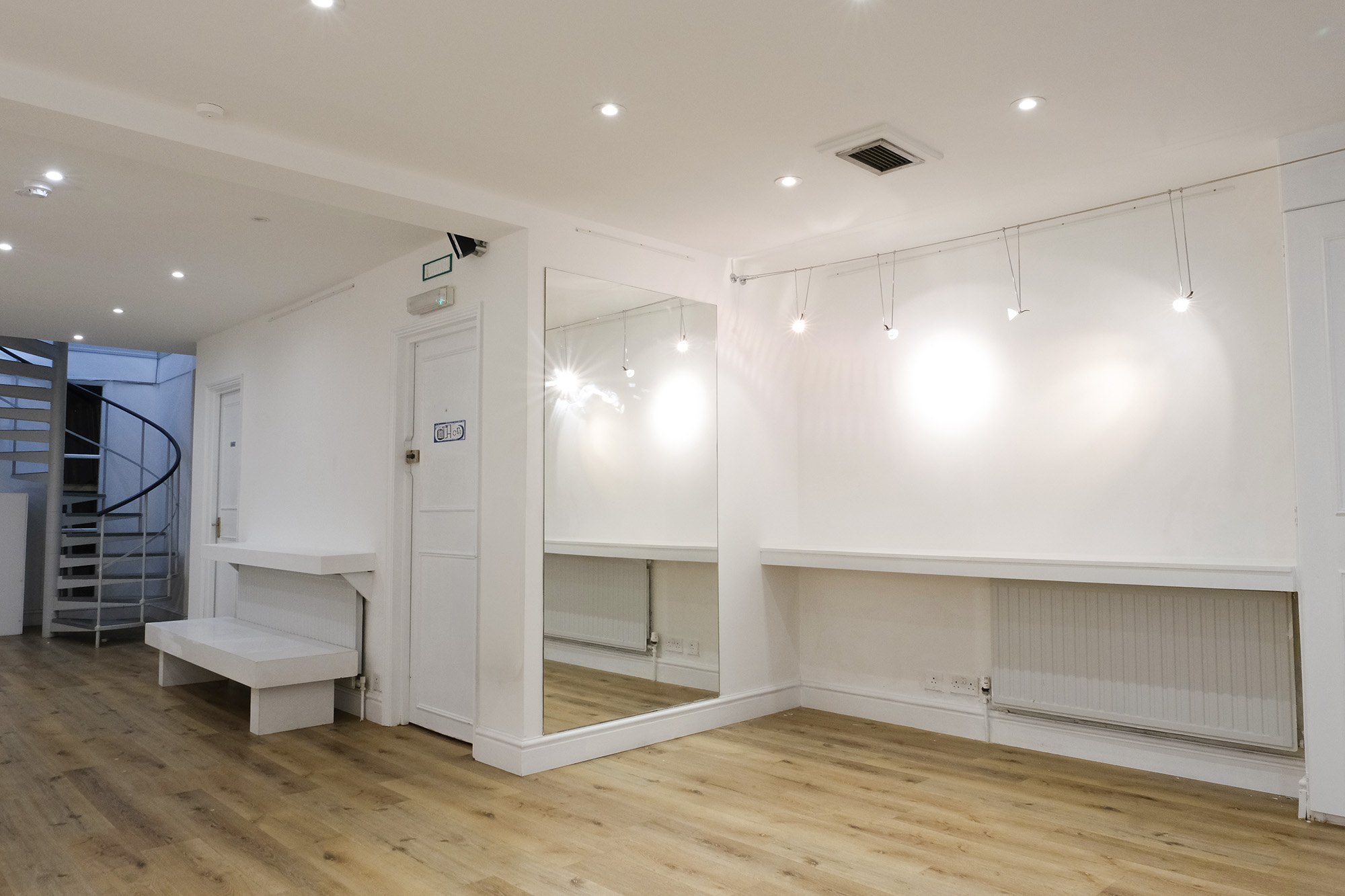 The mirror wall and benches