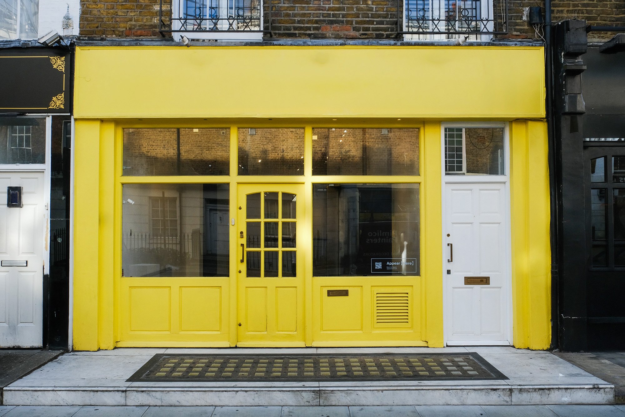 The gallery’s bright yellow shopfront at 7 Denbigh Street